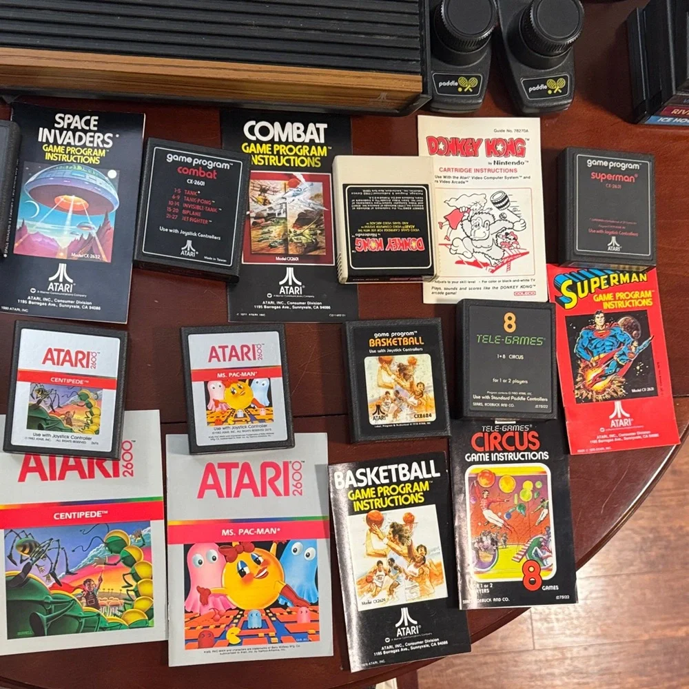 Vintage Authentic Atari 2600 with controllers, games and instruction booklets.